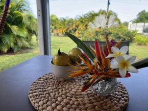 Bungalow cosy dans jardin tropical